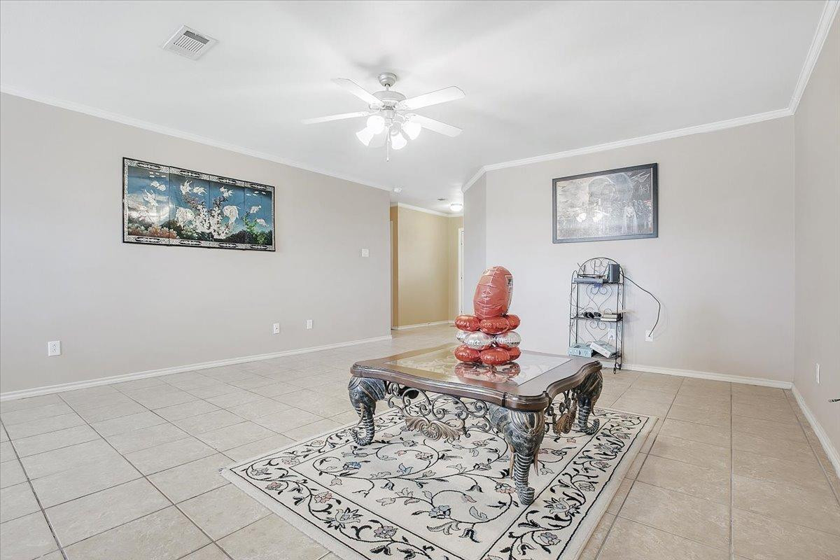 903 Xavier Street Lubbock, TX 79403 - Photo 12 of 28 a living room with furniture and wooden floor
