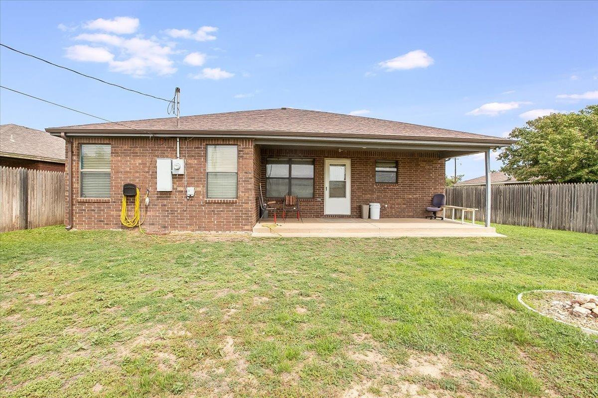 903 Xavier Street Lubbock, TX 79403 - Photo 26 of 28 a front view of house with a garden