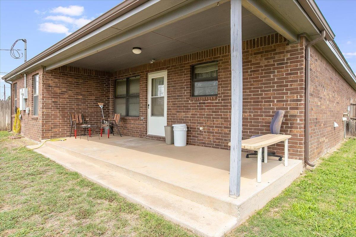 903 Xavier Street Lubbock, TX 79403 - Photo 27 of 28 a balcony with furniture and a window