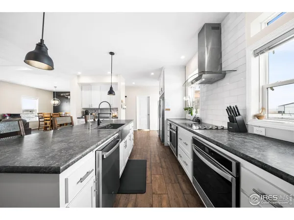 a kitchen with a table and chairs