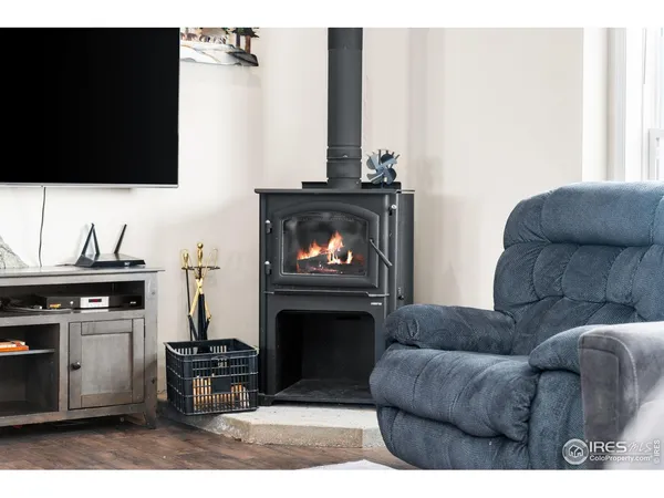 a view of a livingroom and dining room and wooden floor