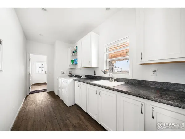 a kitchen with cabinets and a stove