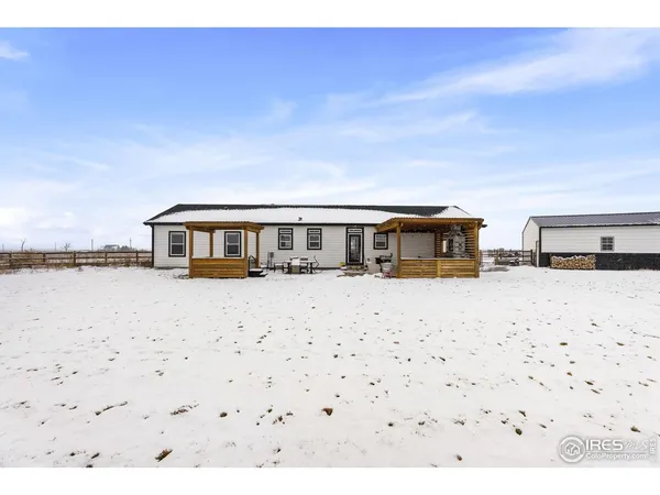 a view of a living room and floor to ceiling window