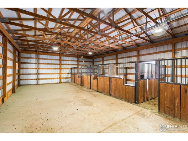 a view of a roof deck with chair and wooden floor