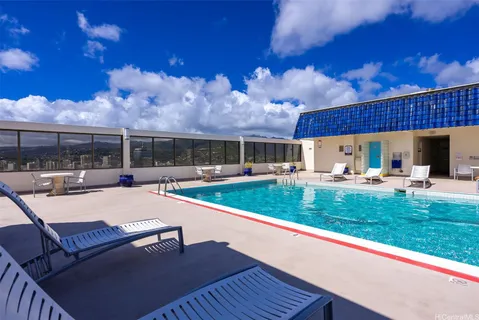 a view of a swimming pool with a patio