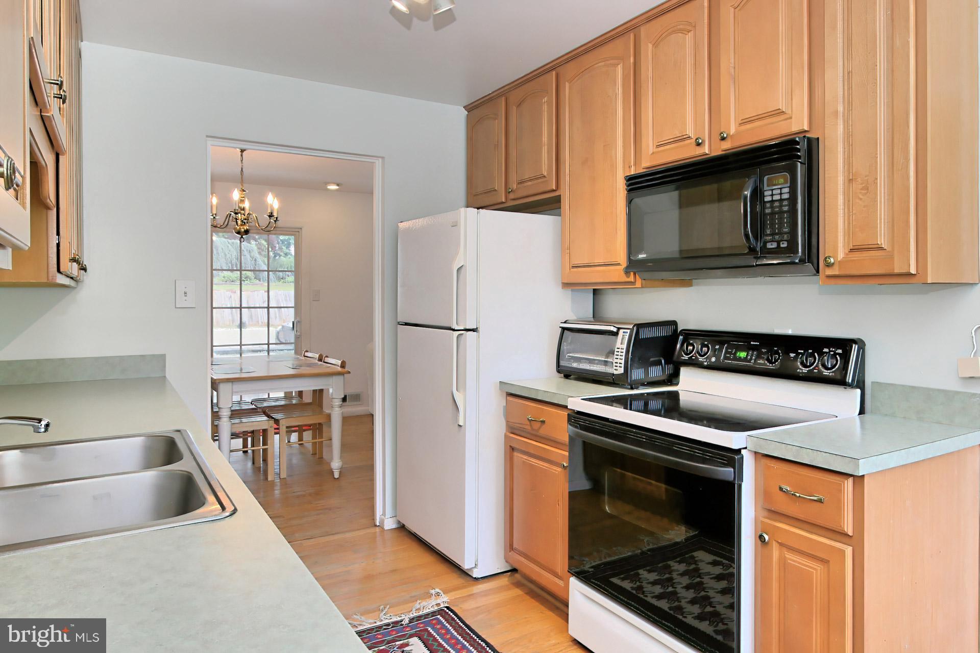 6305 Gormley Place Springfield, VA 22152 - Photo 16 of 66 Kitchen has flat top range and built in microwave