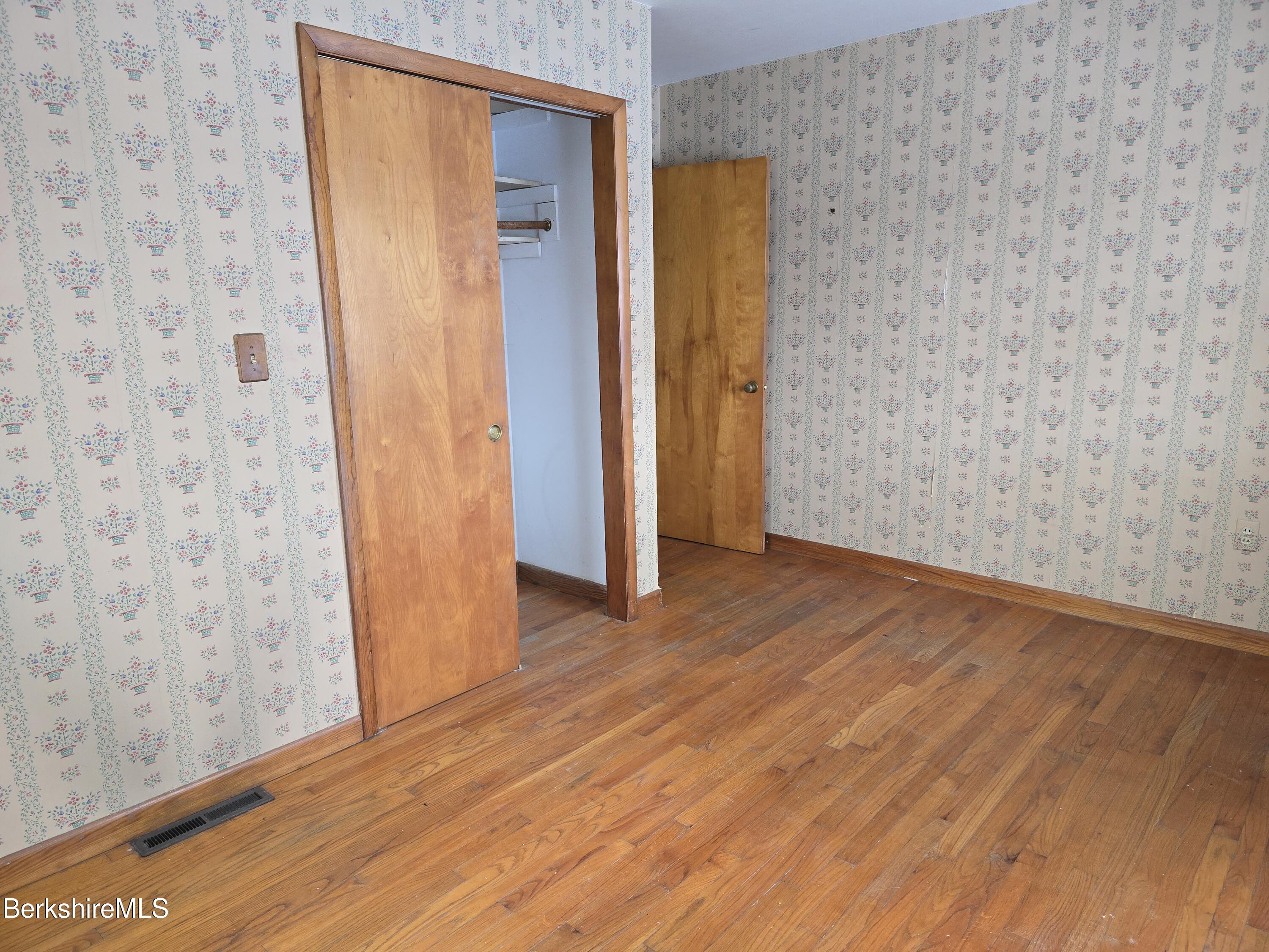 15 W Road Adams, MA 01220 - Photo 23 of 37 a view of a hallway with wooden floor and a bathroom