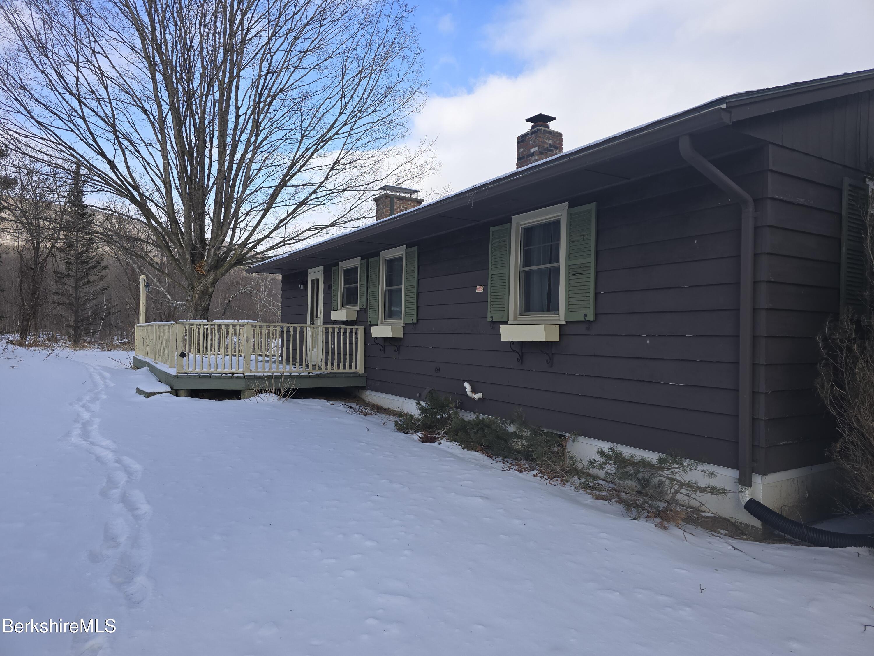 15 W Road Adams, MA 01220 - Photo 32 of 37 a front view of a house with a yard
