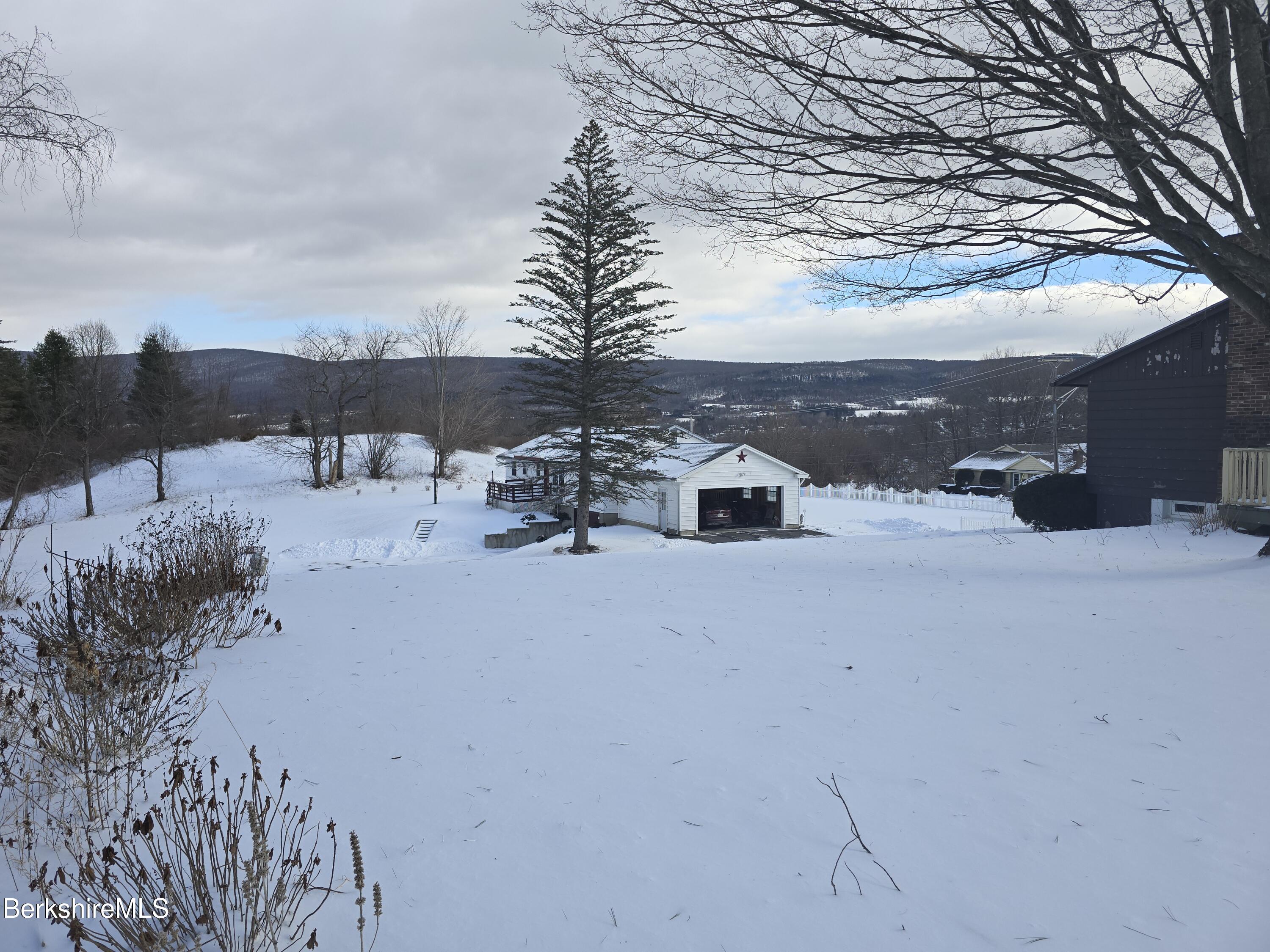 15 W Road Adams, MA 01220 - Photo 34 of 37 a view of a terrace with a bench and trees