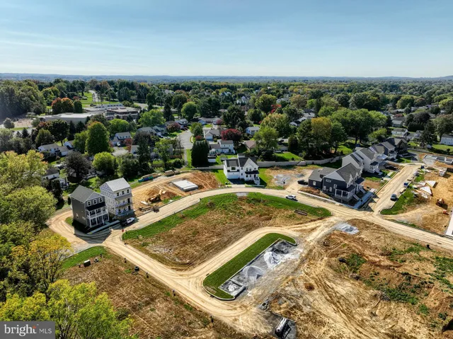 an aerial view of a swimming pool and mountain view