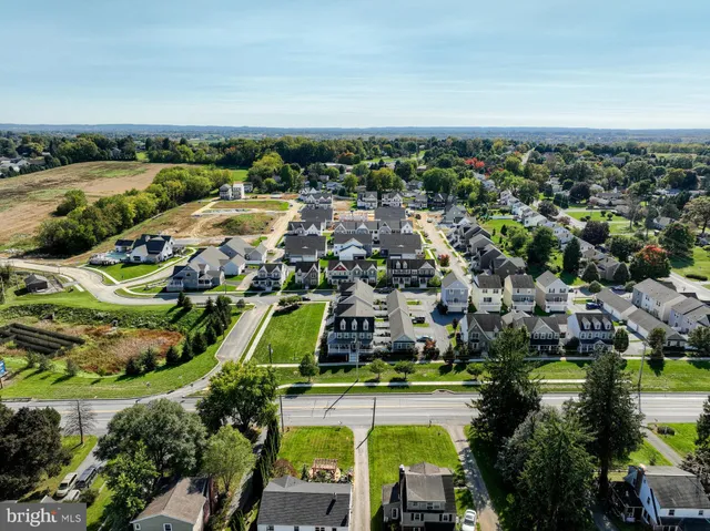 an aerial view of a house with a garden