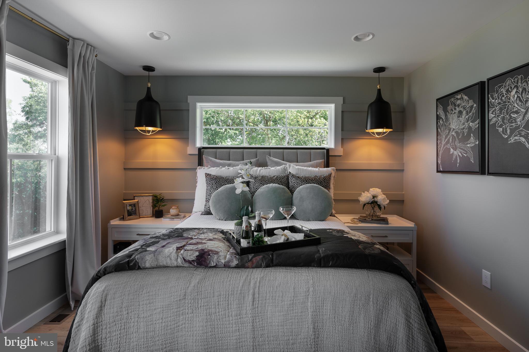 2234 Coach Light Lane Lancaster, PA 17601 - Photo 4 of 20 a bedroom with a bed and large windows