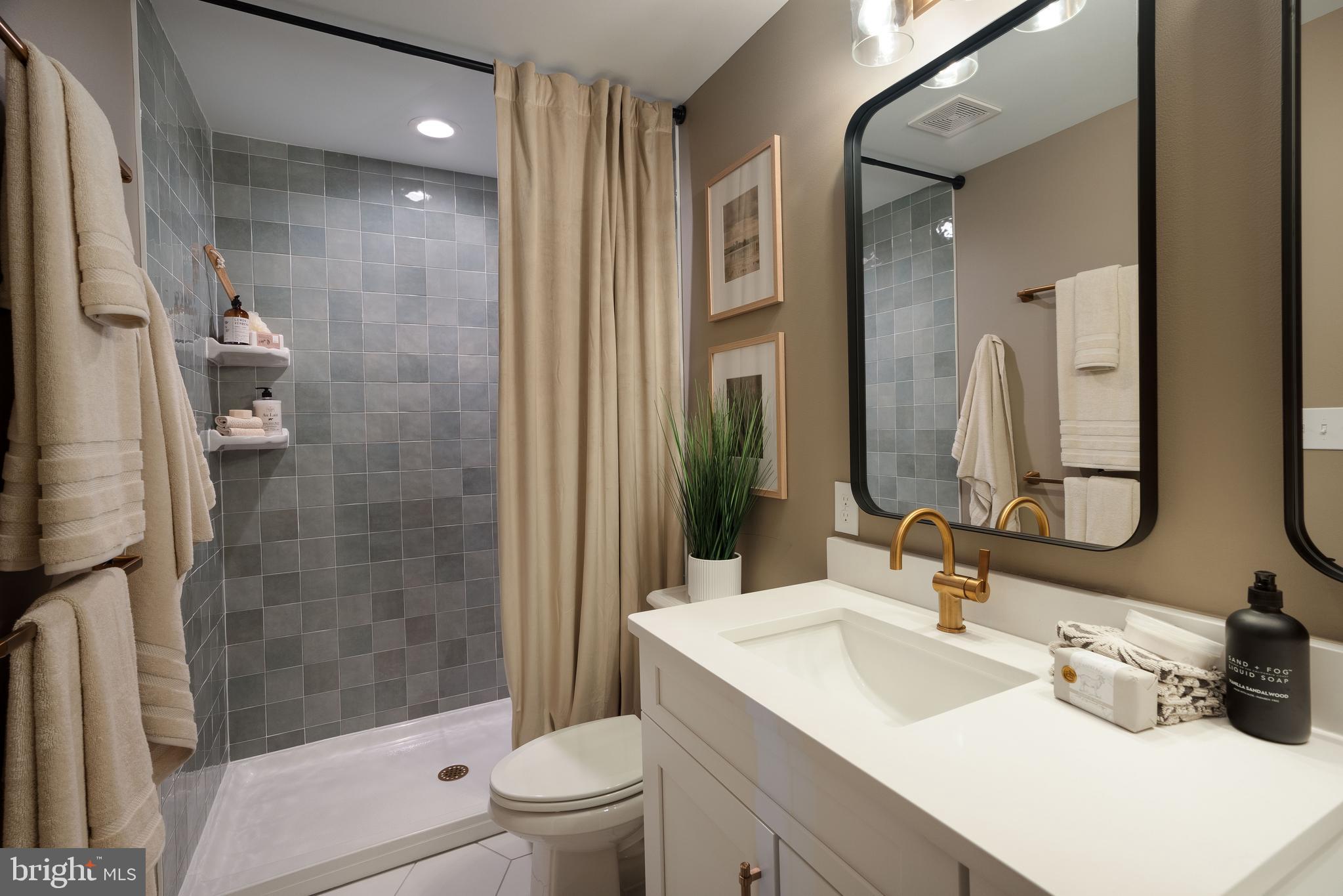 2234 Coach Light Lane Lancaster, PA 17601 - Photo 5 of 20 a bathroom with a sink a toilet and shower