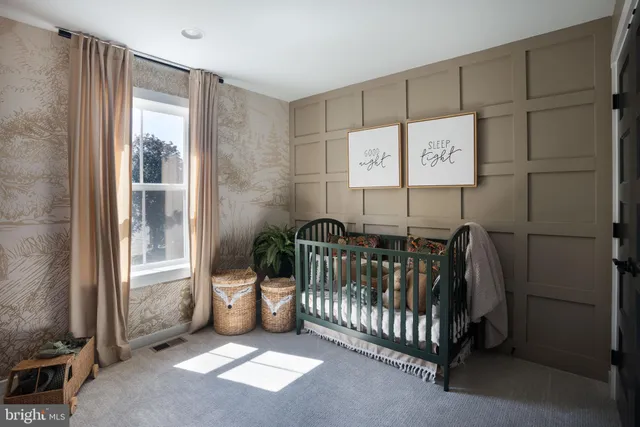 a view of a room with furniture and a window