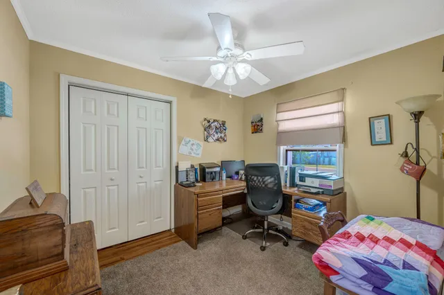 a bedroom with a workspace