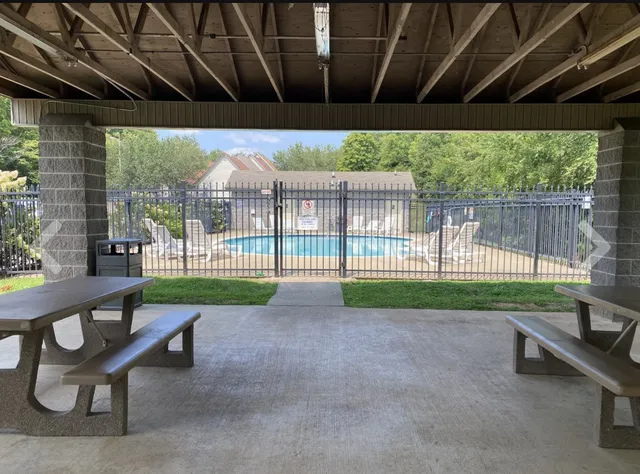 a view of a porch with furniture and garden