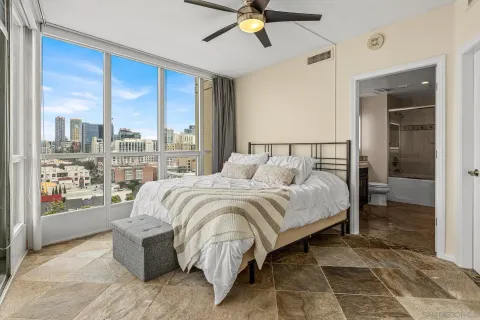 a bed sitting in a bedroom next to a window