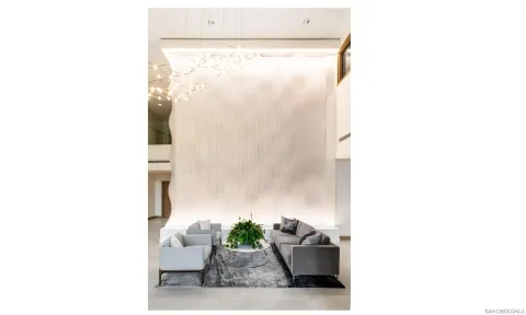 a room with a cabinet and a potted plant