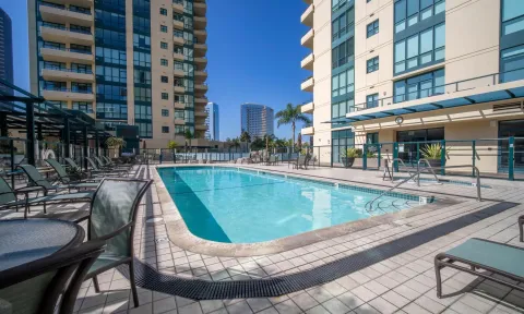 a view of a swimming pool with a chairs and tables