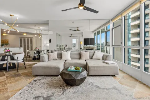 a living room with furniture and a large window