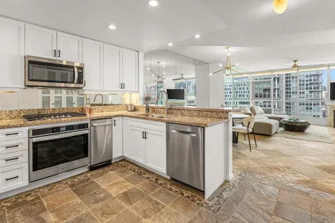 a kitchen with a stove a sink and a microwave