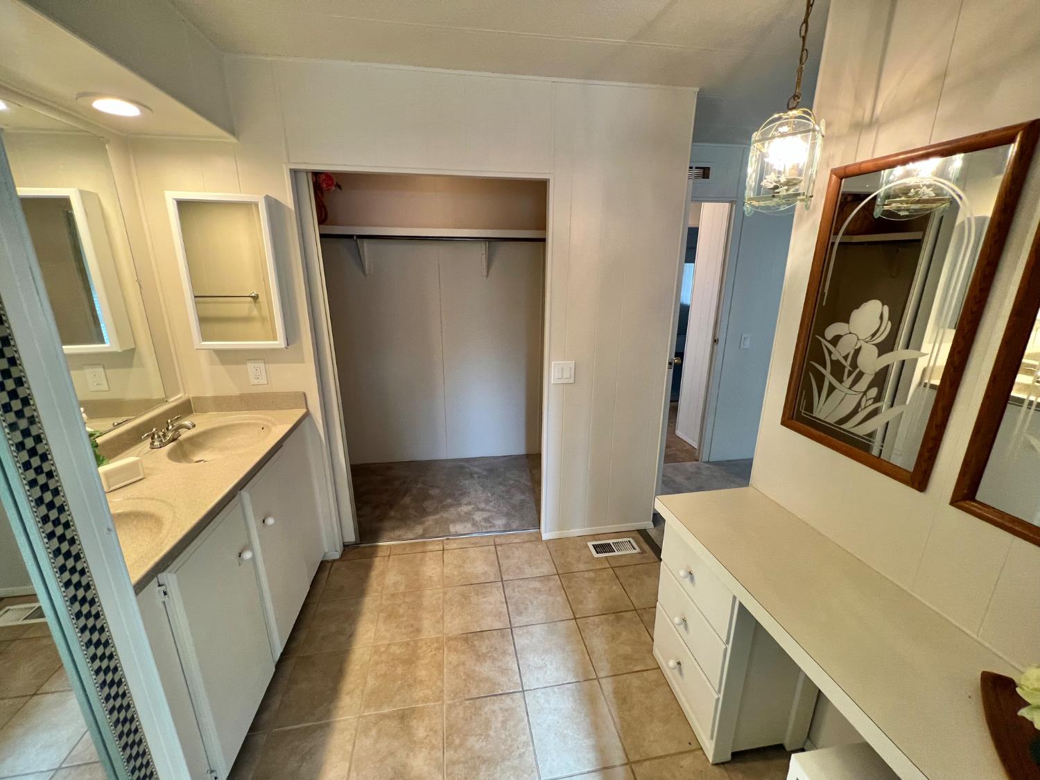 3955 Coffee Road, Unit 53 Modesto, CA 95355 - Photo 11 of 39 a bathroom with a sink a mirror and a bathtub