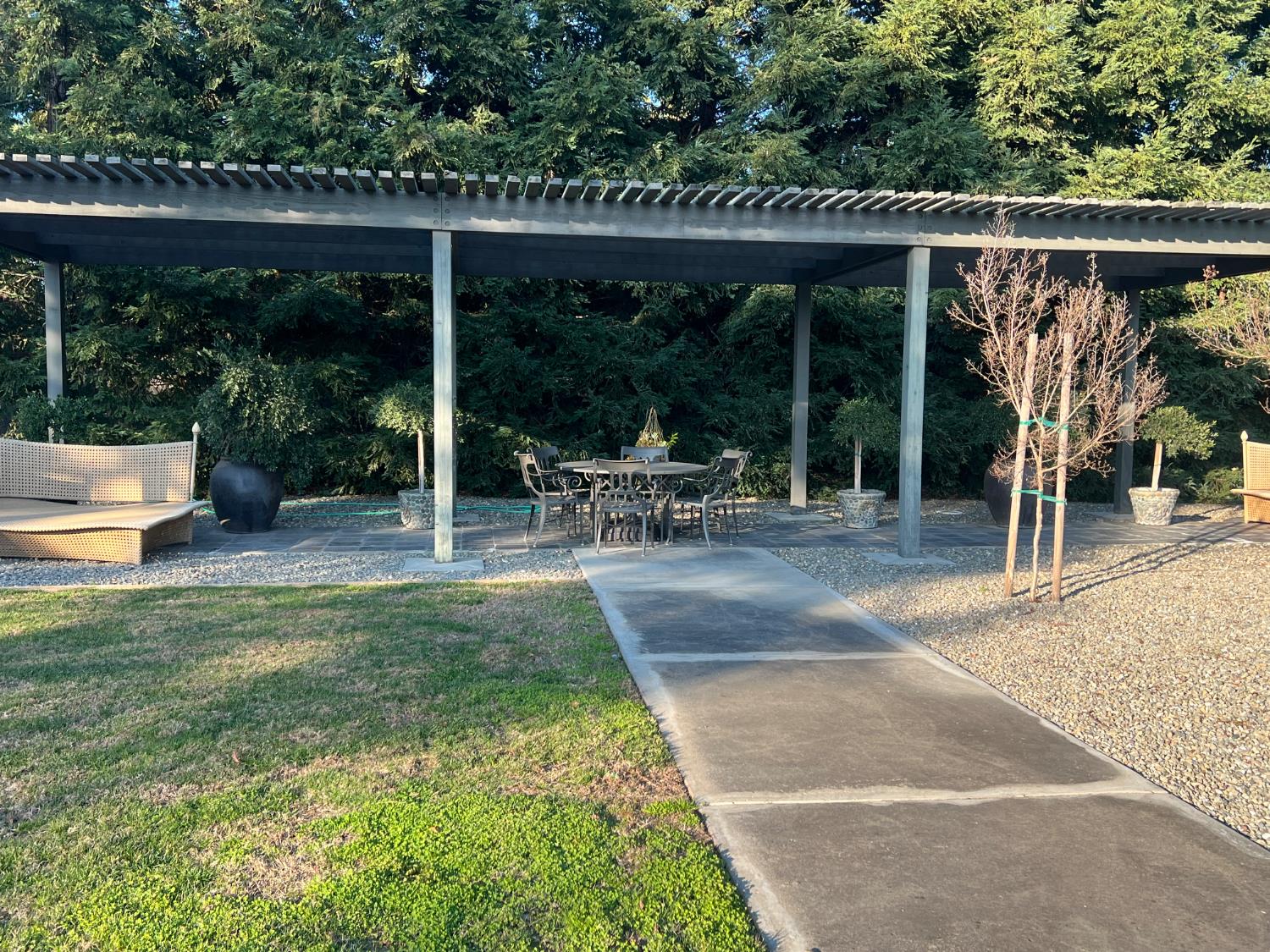 3955 Coffee Road, Unit 53 Modesto, CA 95355 - Photo 17 of 39 a view of backyard with table and chairs and potted plants