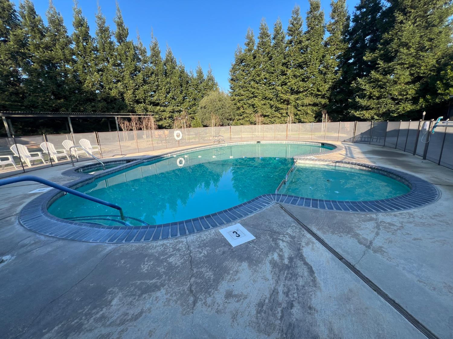 3955 Coffee Road, Unit 53 Modesto, CA 95355 - Photo 19 of 39 a view of a swimming pool with an outdoor space