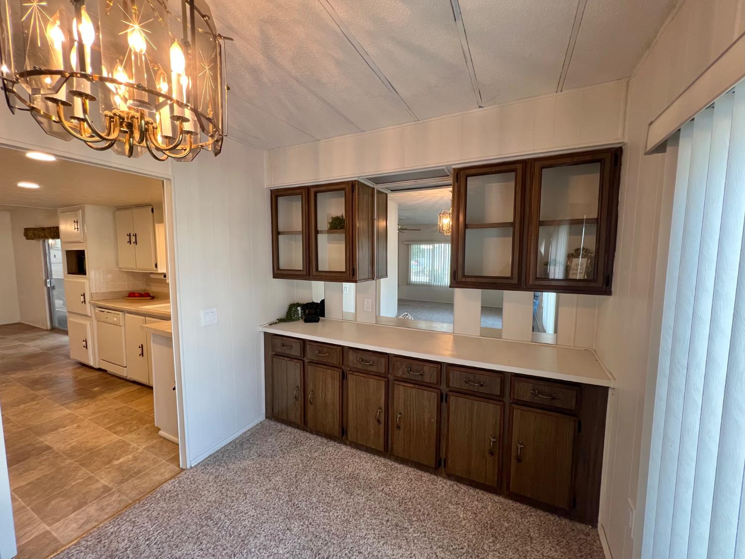 3955 Coffee Road, Unit 53 Modesto, CA 95355 - Photo 25 of 39 a view of a kitchen with a sink stainless steel appliances and cabinets