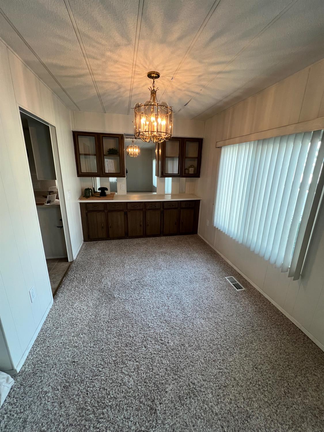 3955 Coffee Road, Unit 53 Modesto, CA 95355 - Photo 26 of 39 a view of entryway with chandelier