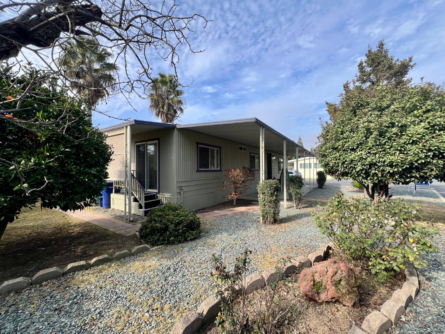 3955 Coffee Road, Unit 53 Modesto, CA 95355 - Photo 31 of 39 a front view of a house with garden