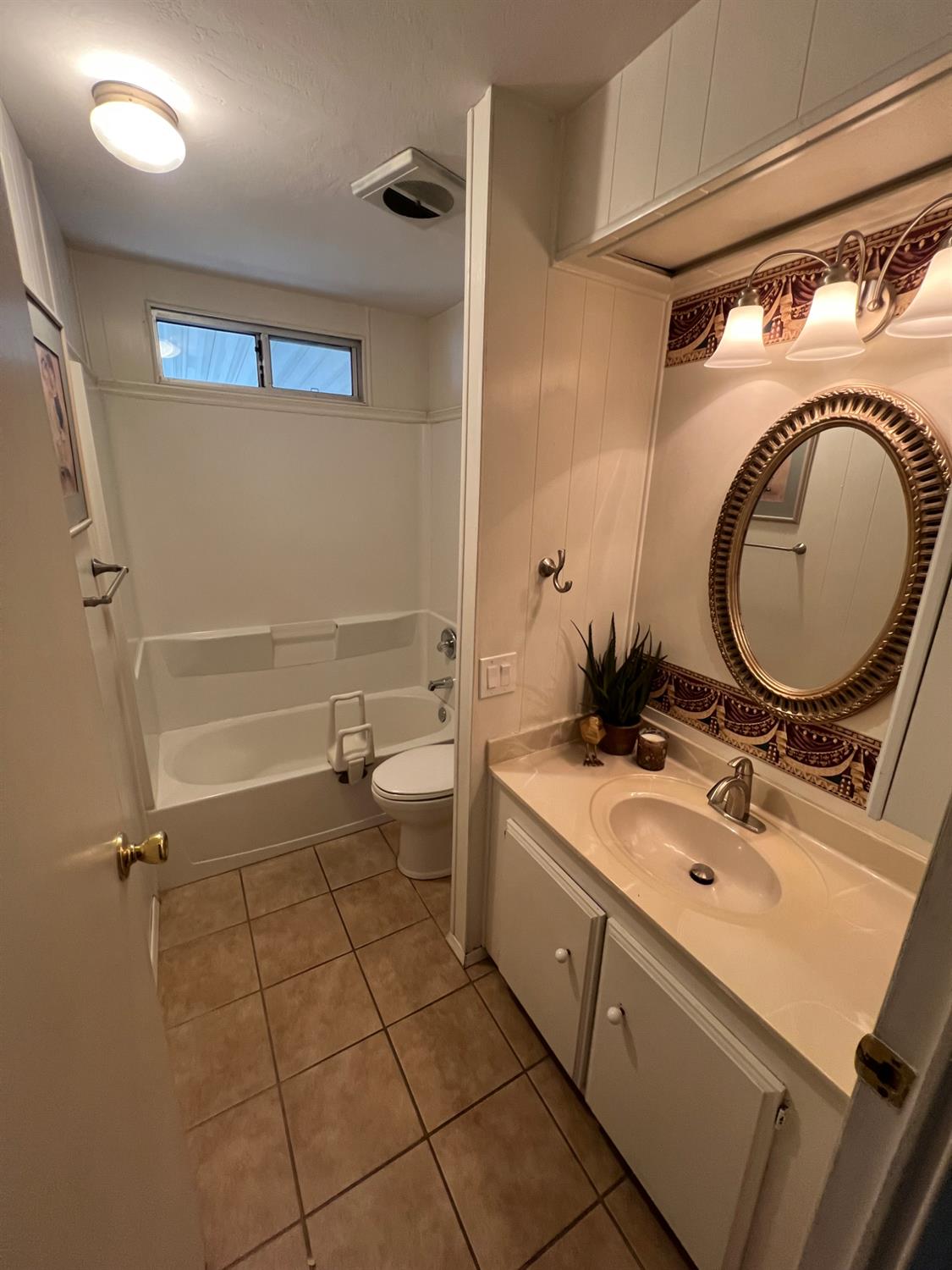 3955 Coffee Road, Unit 53 Modesto, CA 95355 - Photo 34 of 39 a bathroom with a double vanity sink mirror and toilet