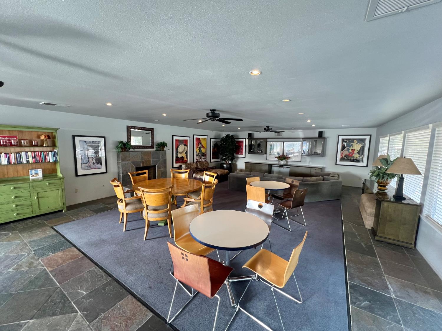 3955 Coffee Road, Unit 53 Modesto, CA 95355 - Photo 36 of 39 a open kitchen with stainless steel appliances kitchen island granite countertop a table and chairs in it