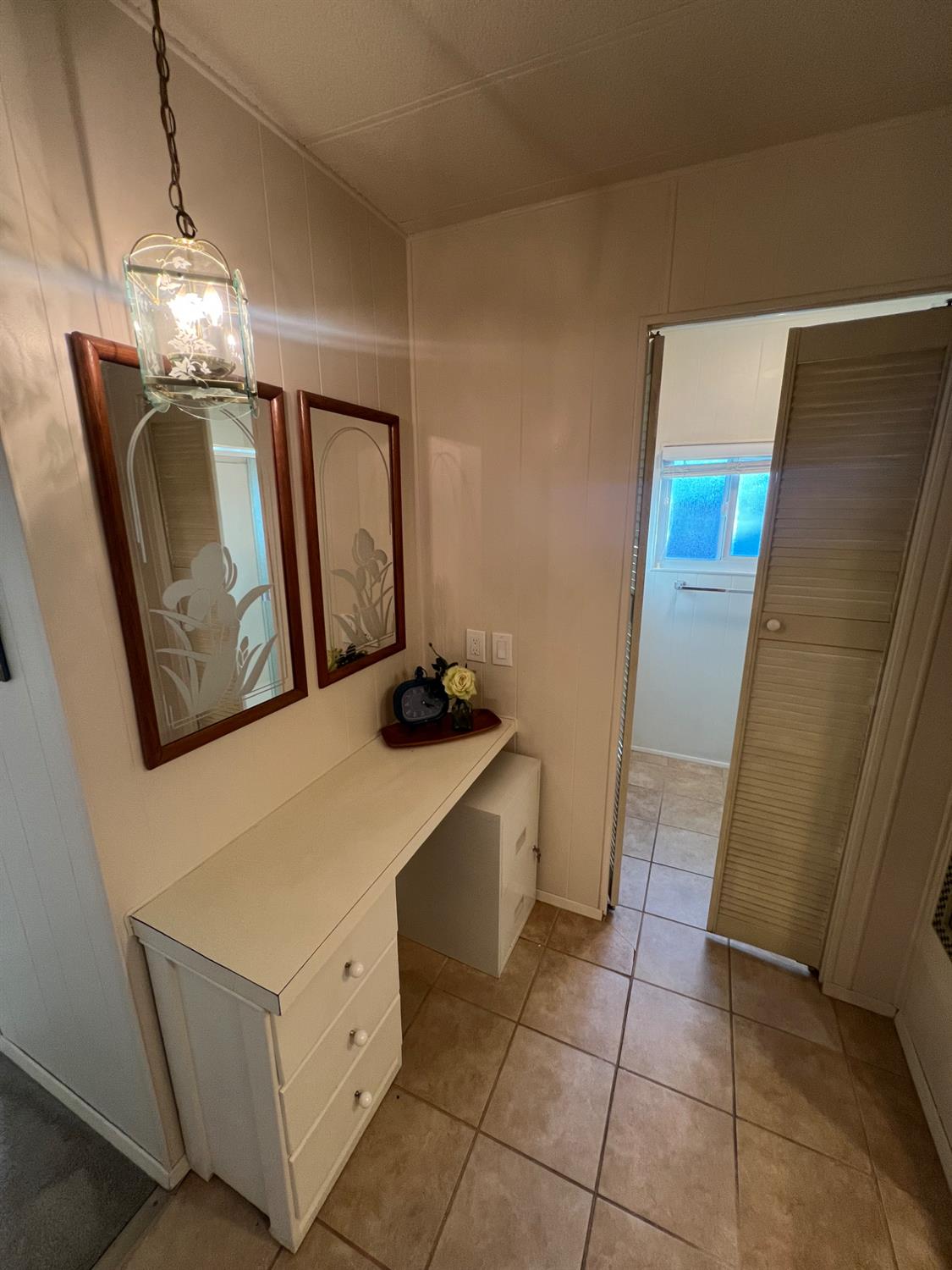 3955 Coffee Road, Unit 53 Modesto, CA 95355 - Photo 9 of 39 a bathroom with a sink a mirror and a shower