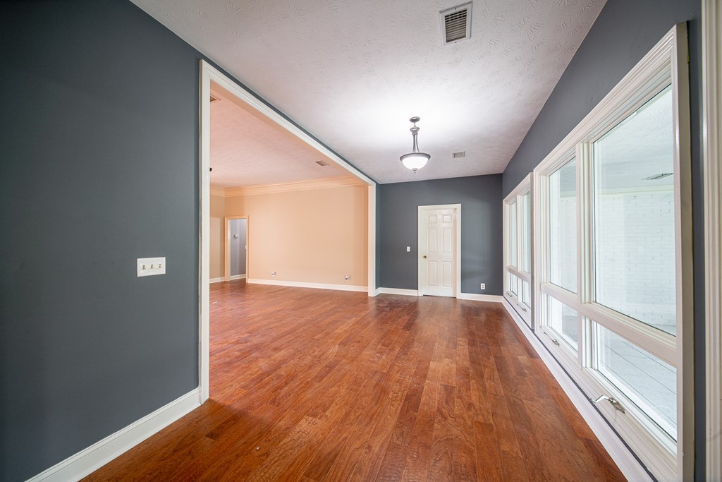 5 Mink Court Midland, GA 31820 - Photo 21 of 42 a view of an empty room with wooden floor and a window