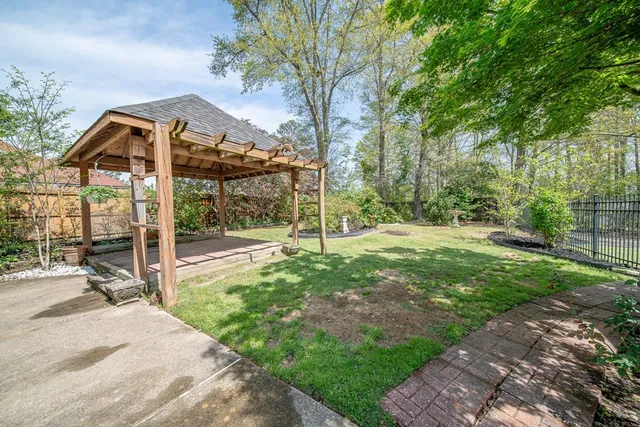 a view of a backyard with sitting area