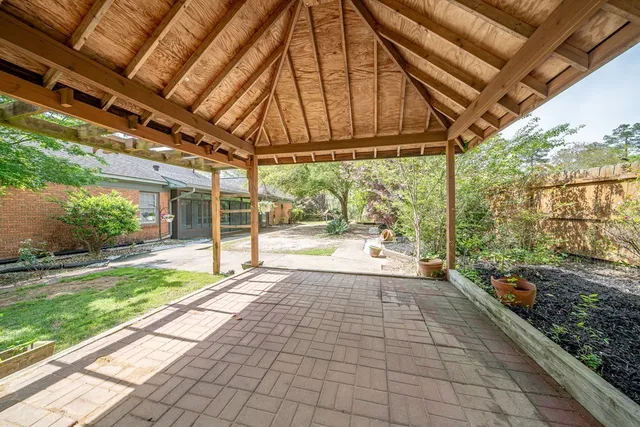 a view of a backyard of the house