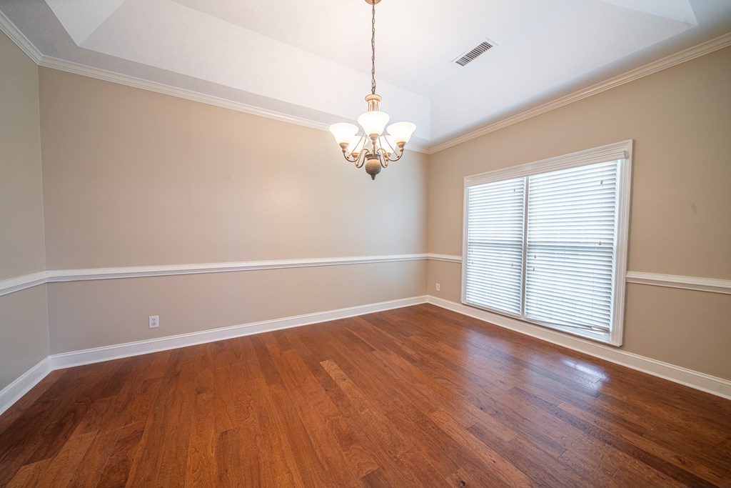 5 Mink Court Midland, GA 31820 - Photo 8 of 42 wooden floor in an empty room with a window