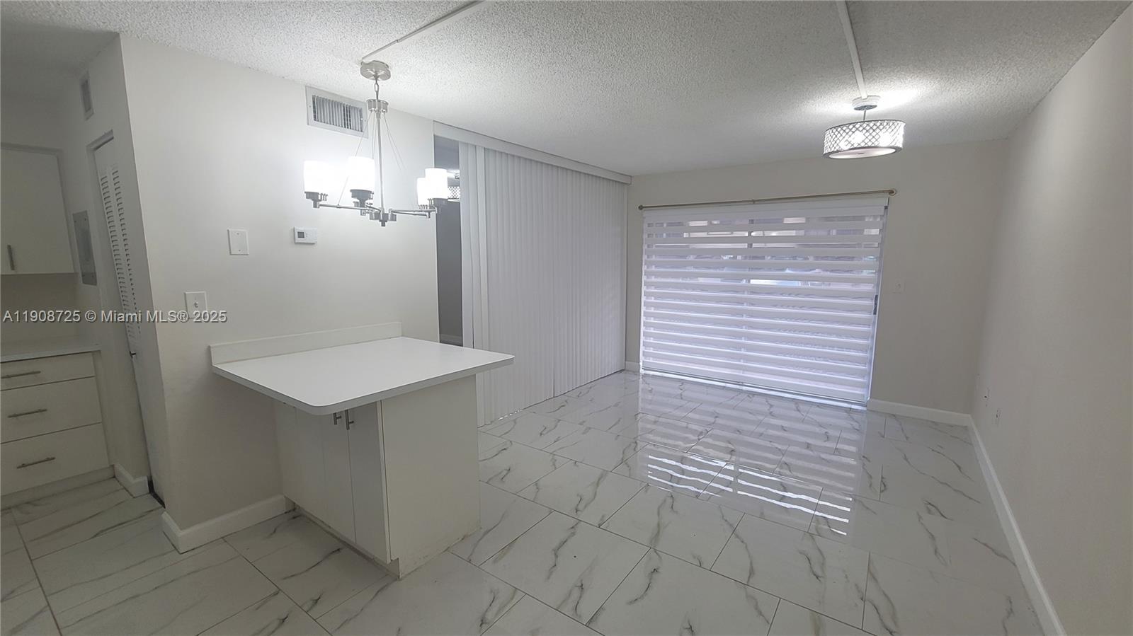 5201 Northwest 7th Street, Unit 106 Miami, FL 33126 - Photo 1 of 20 a bathroom with a sink shower and a mirror