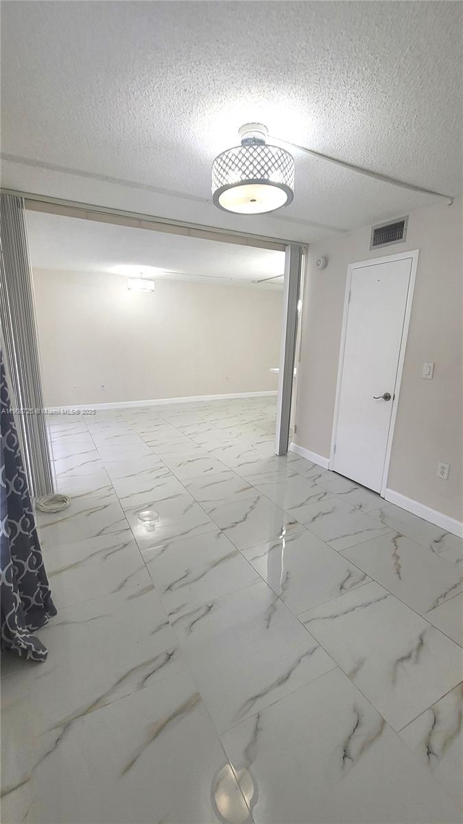 5201 Northwest 7th Street, Unit 106 Miami, FL 33126 - Photo 14 of 20 a view of empty room