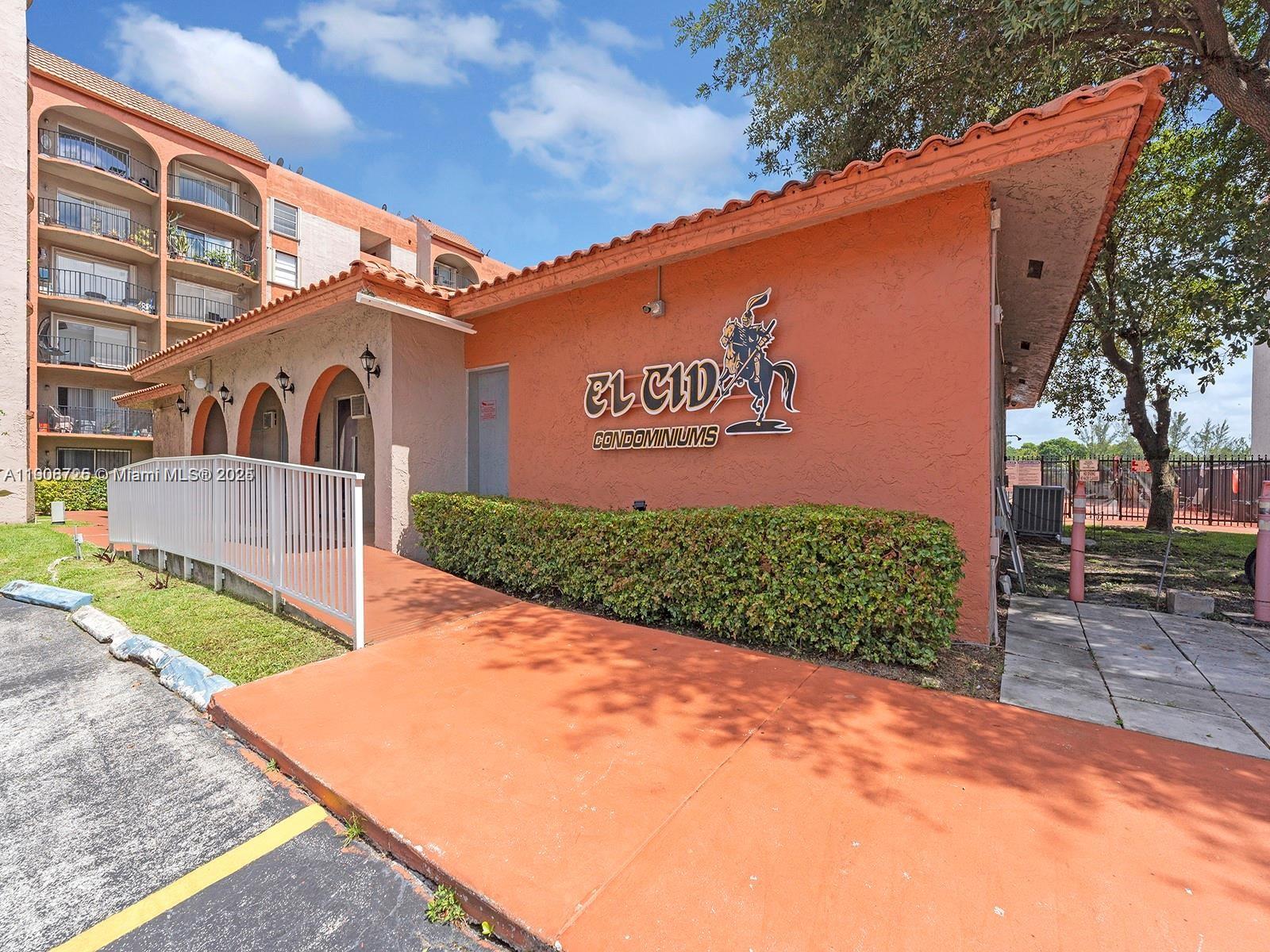 5201 Northwest 7th Street, Unit 106 Miami, FL 33126 - Photo 16 of 20 a front view of a house with garden