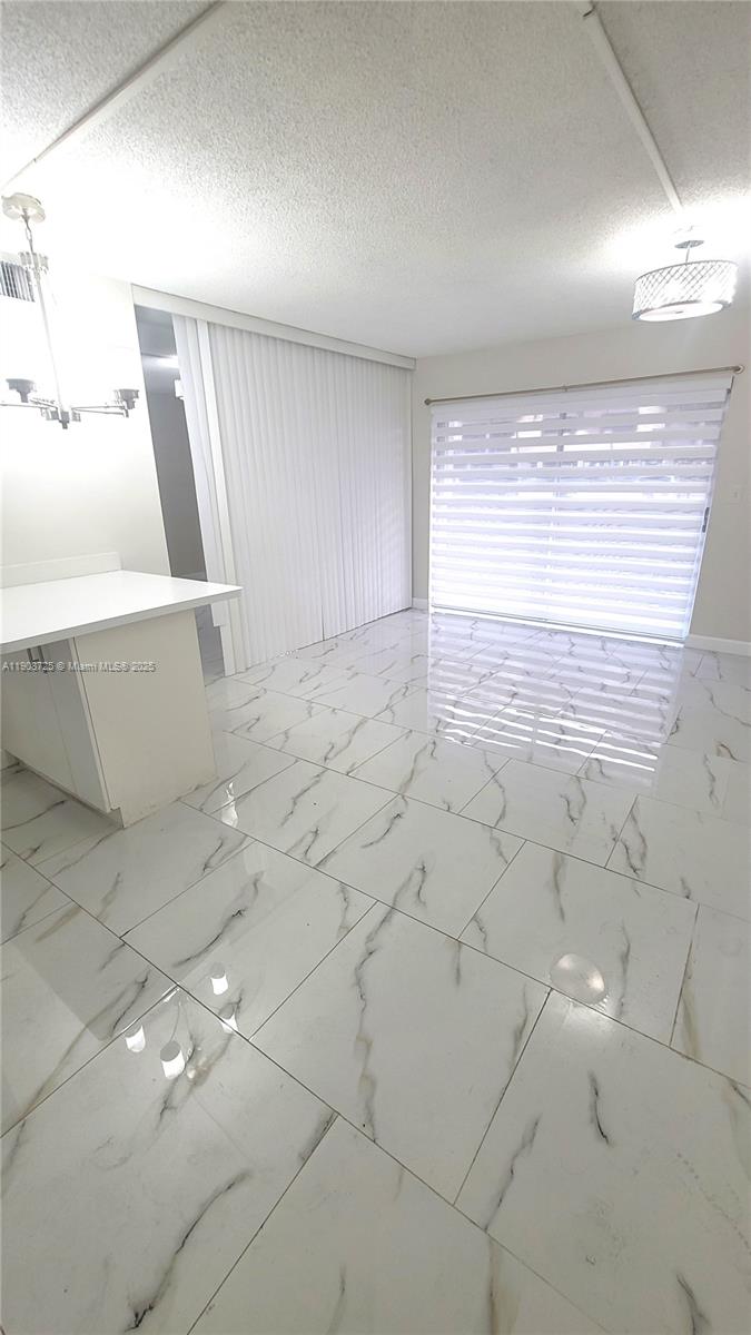 5201 Northwest 7th Street, Unit 106 Miami, FL 33126 - Photo 4 of 20 a view of empty room