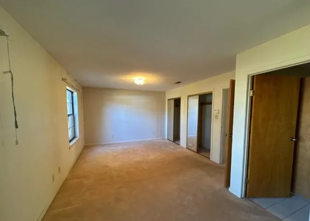 a view of empty room with windows