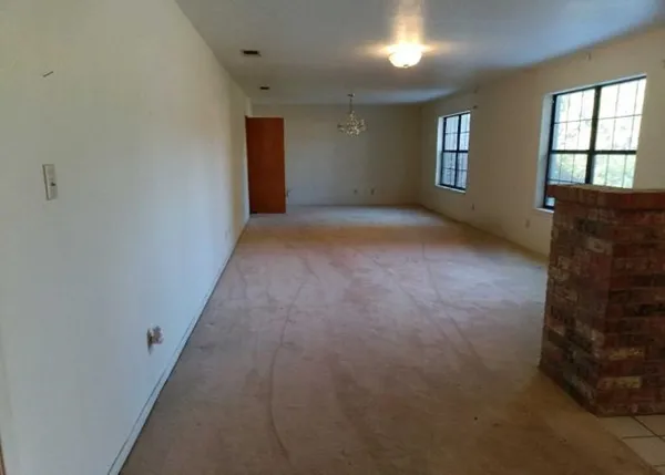 an empty room with windows