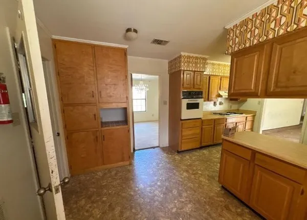 a kitchen with a refrigerator a sink and dishwasher