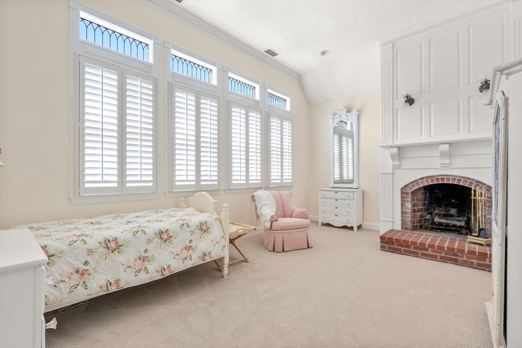 2 Country Way Hopkinton, MA 01748 - Photo 20 of 38 a bedroom with bed and a fireplace
