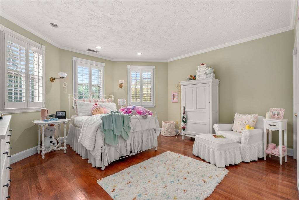 2 Country Way Hopkinton, MA 01748 - Photo 24 of 38 a bedroom with bed and a wooden floor