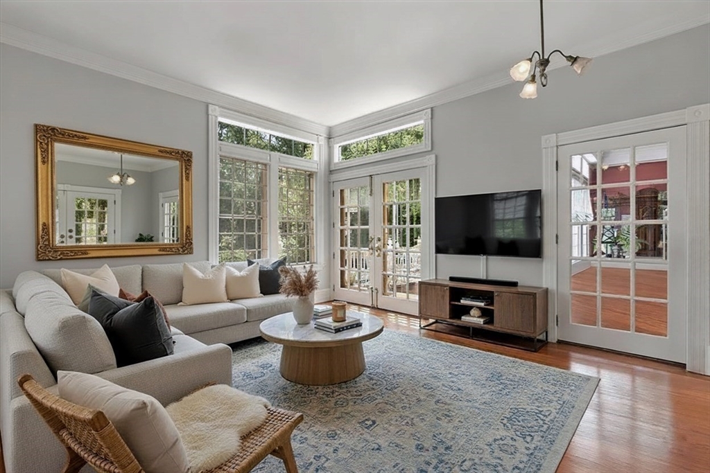 2 Country Way Hopkinton, MA 01748 - Photo 10 of 38 a living room with furniture a flat screen tv and a large window