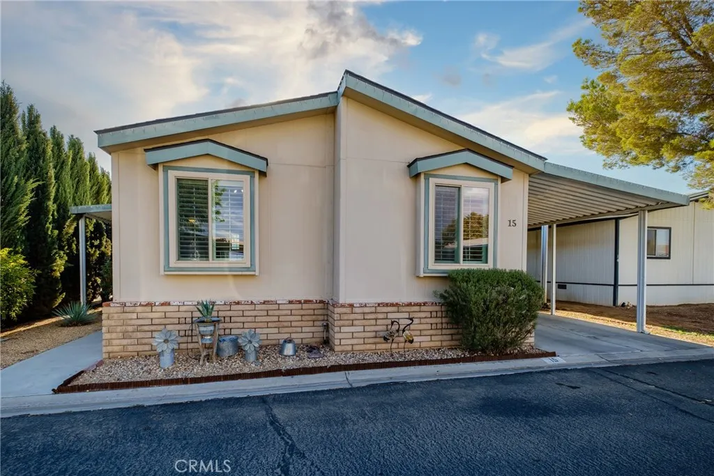 20843 Waalew Road, Unit C15 Apple Valley, CA 92307 - Photo 1 of 1 a front view of a house with a yard