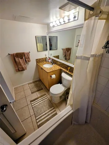 a kitchen with a refrigerator and a stove